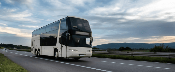 a charter bus travels on a highway