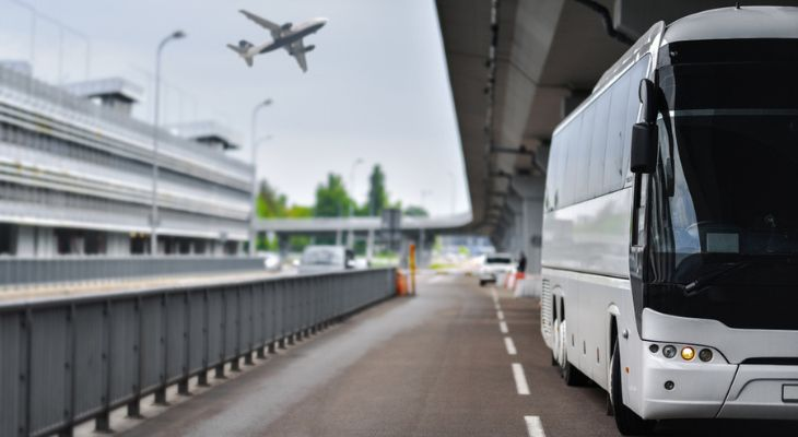 a charter bus parked at an airport