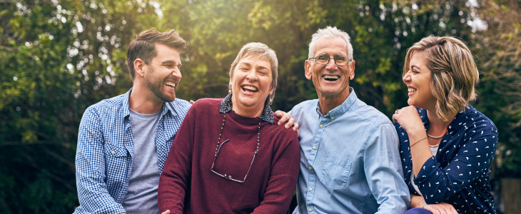 A family hugging and laughing together.