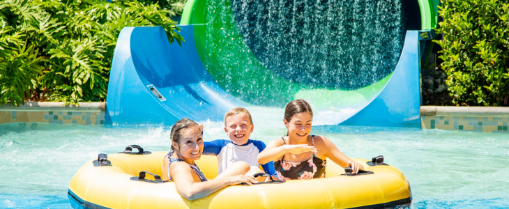 a group of kids playing in a water park