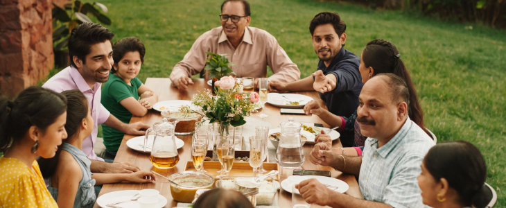 a family gathers at a table