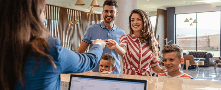 a family checks into a hotel