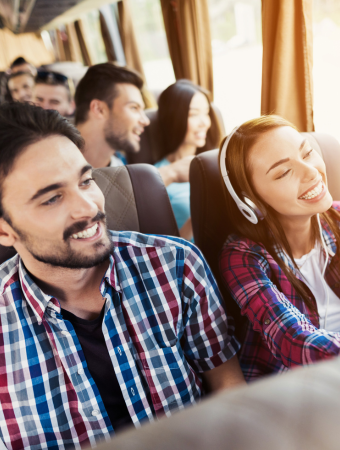 two friends aboard a charter bus 